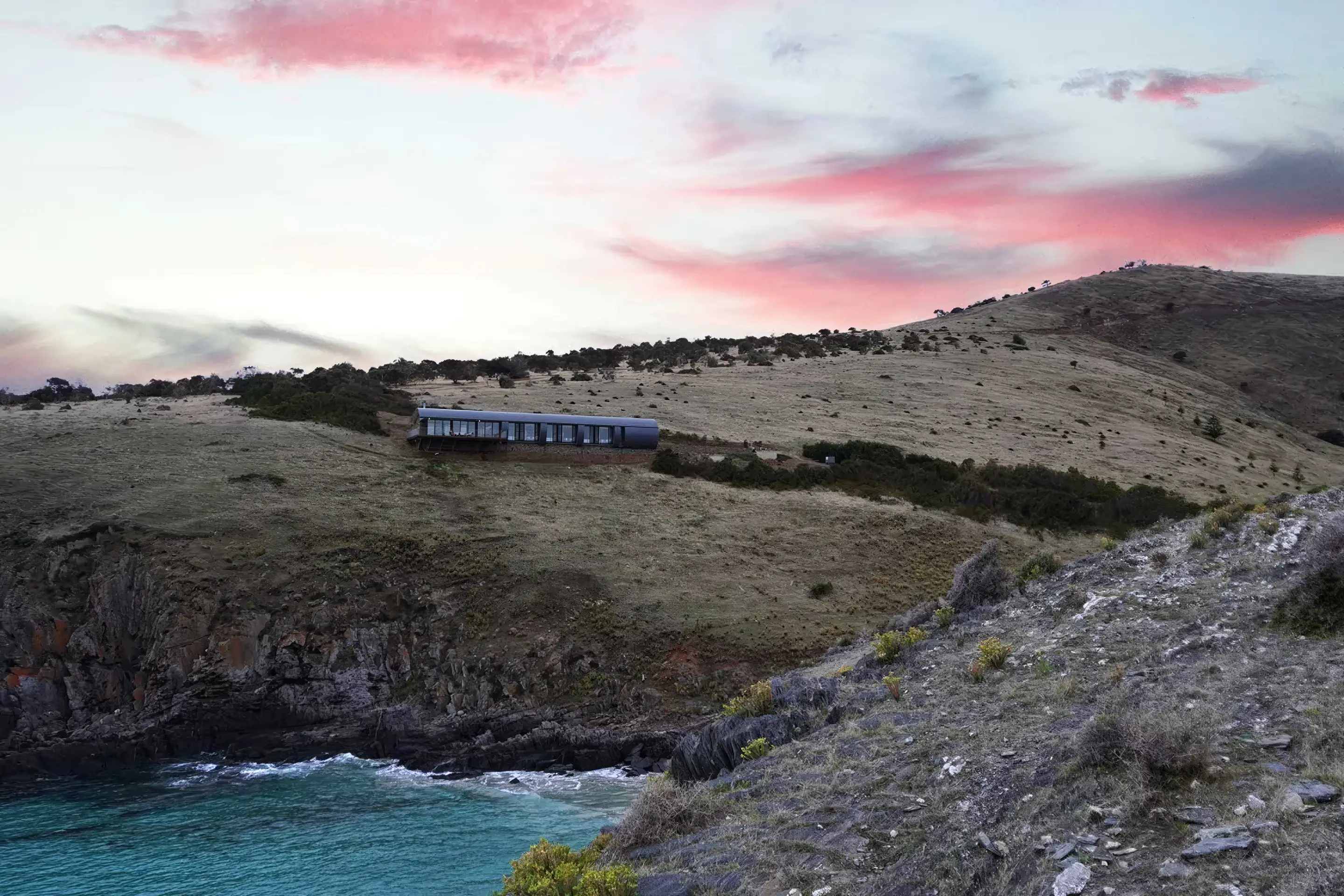 Dawn light over the cove below Naiko Retreat