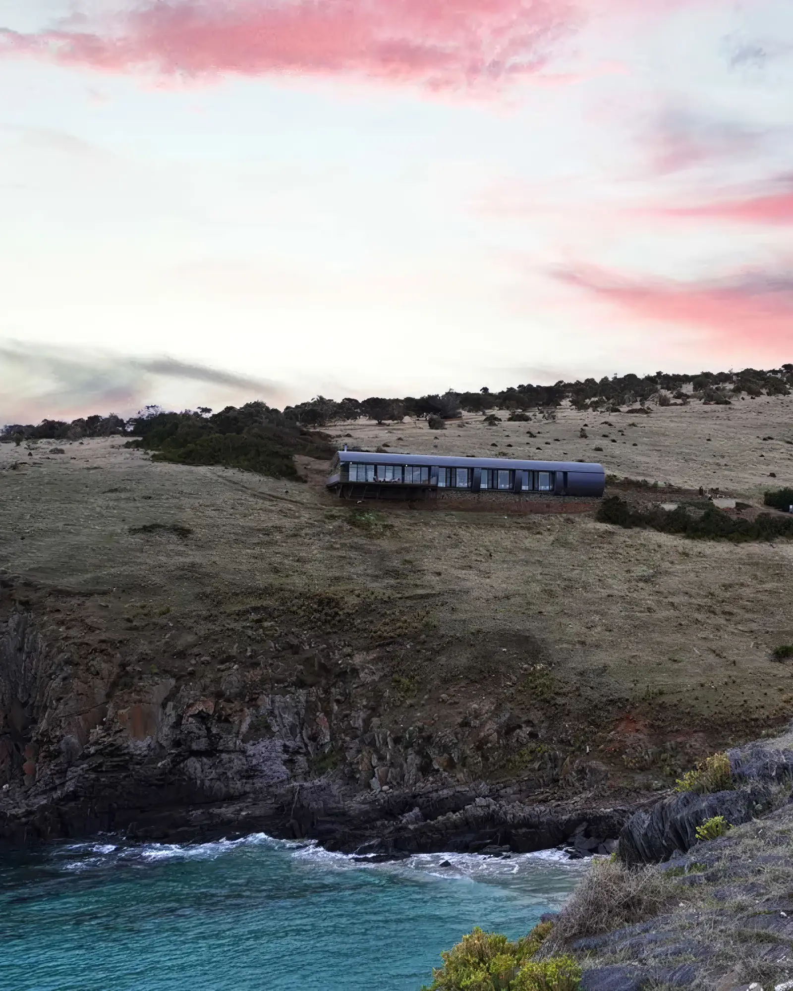 Dawn over the clifftop at Deep Creek, the retreat low on the ridge