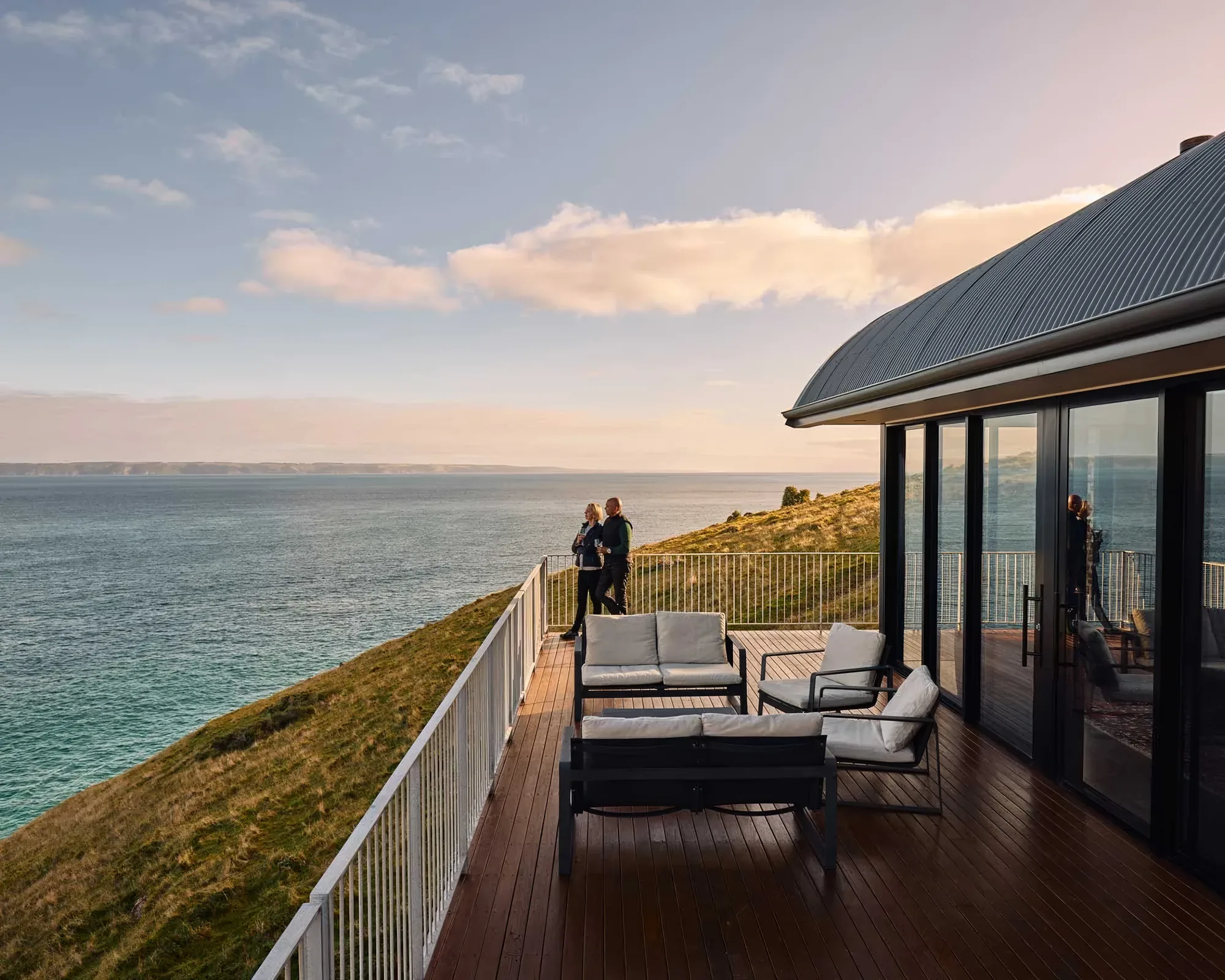 The deck at dusk with the coastline beyond
