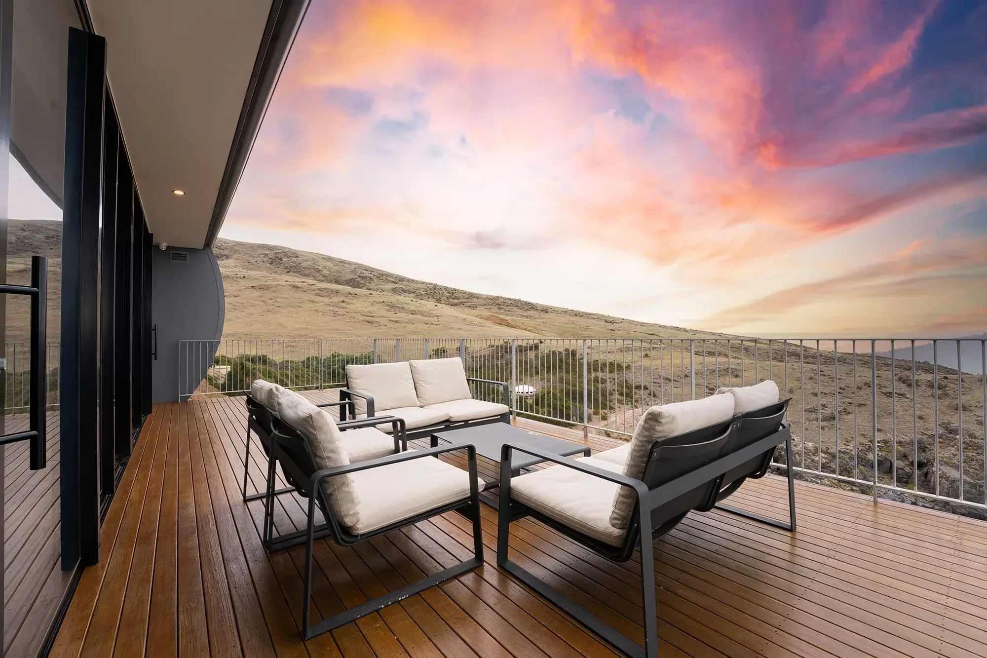 The front deck at sunset above the beach