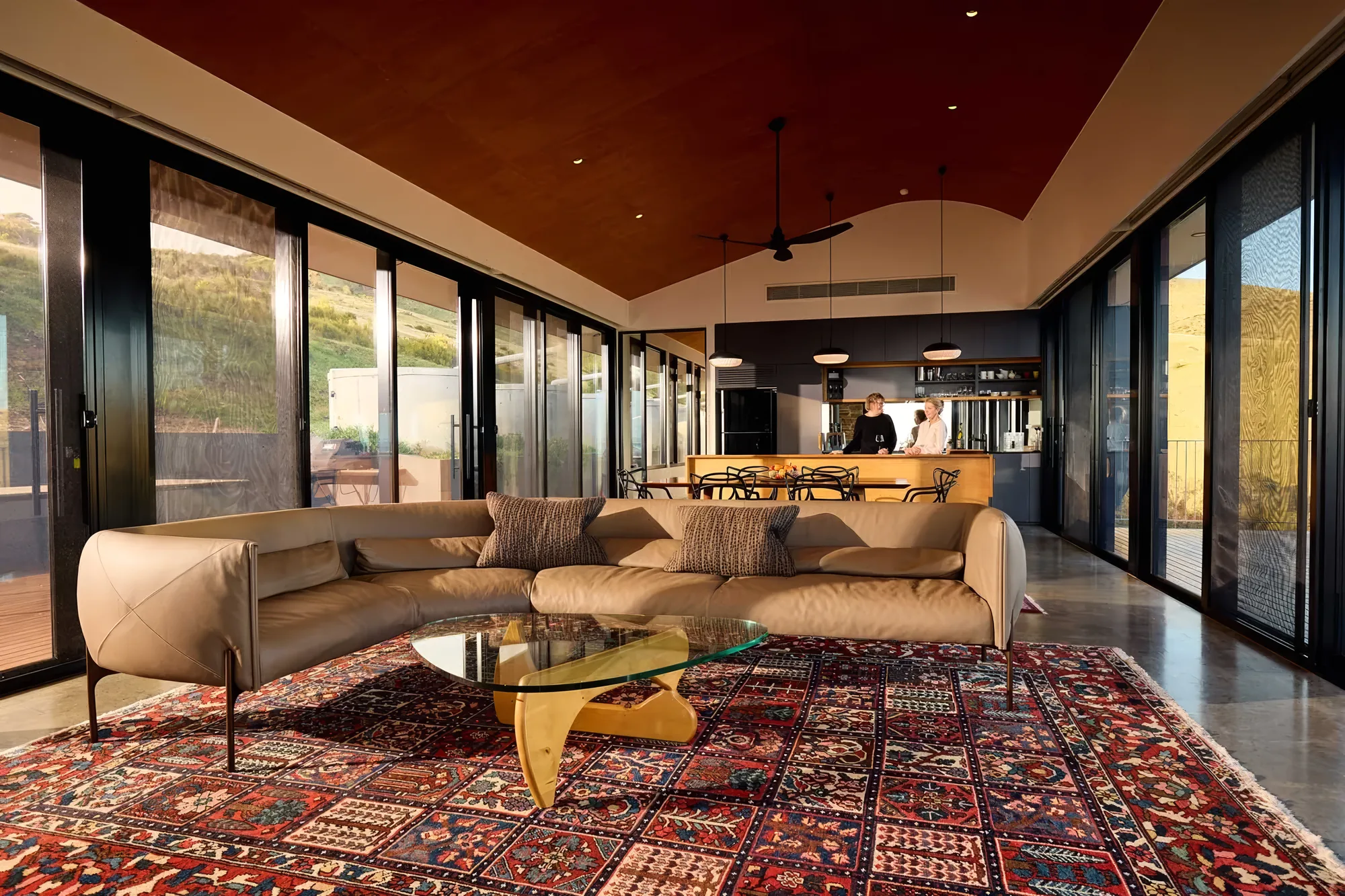 The open-plan great room at Naiko Retreat, framed by floor-to-ceiling glass