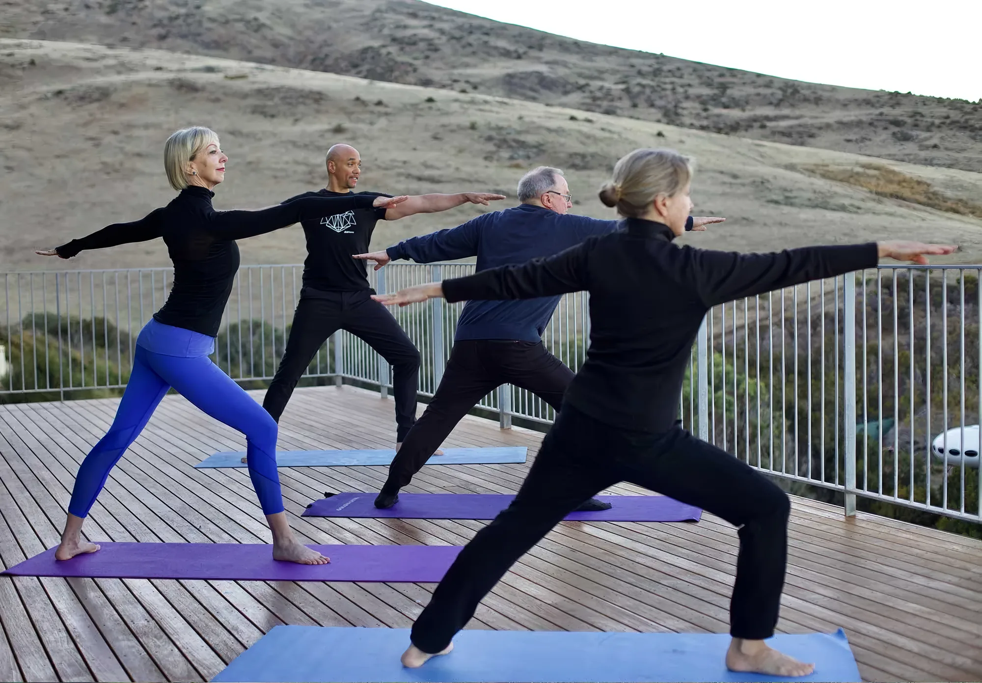 A yoga class on the deck overlooking the ocean