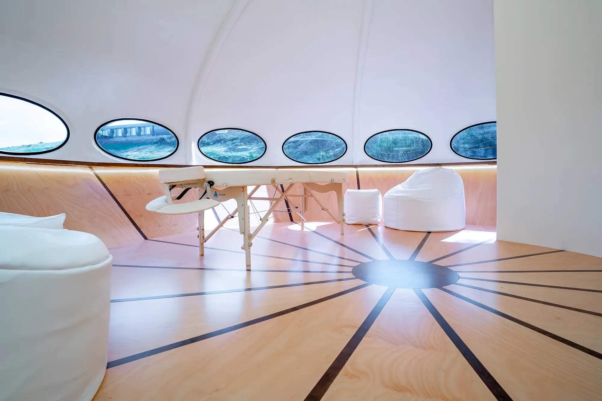 The curved interior of the Futuro with its ring of oval windows