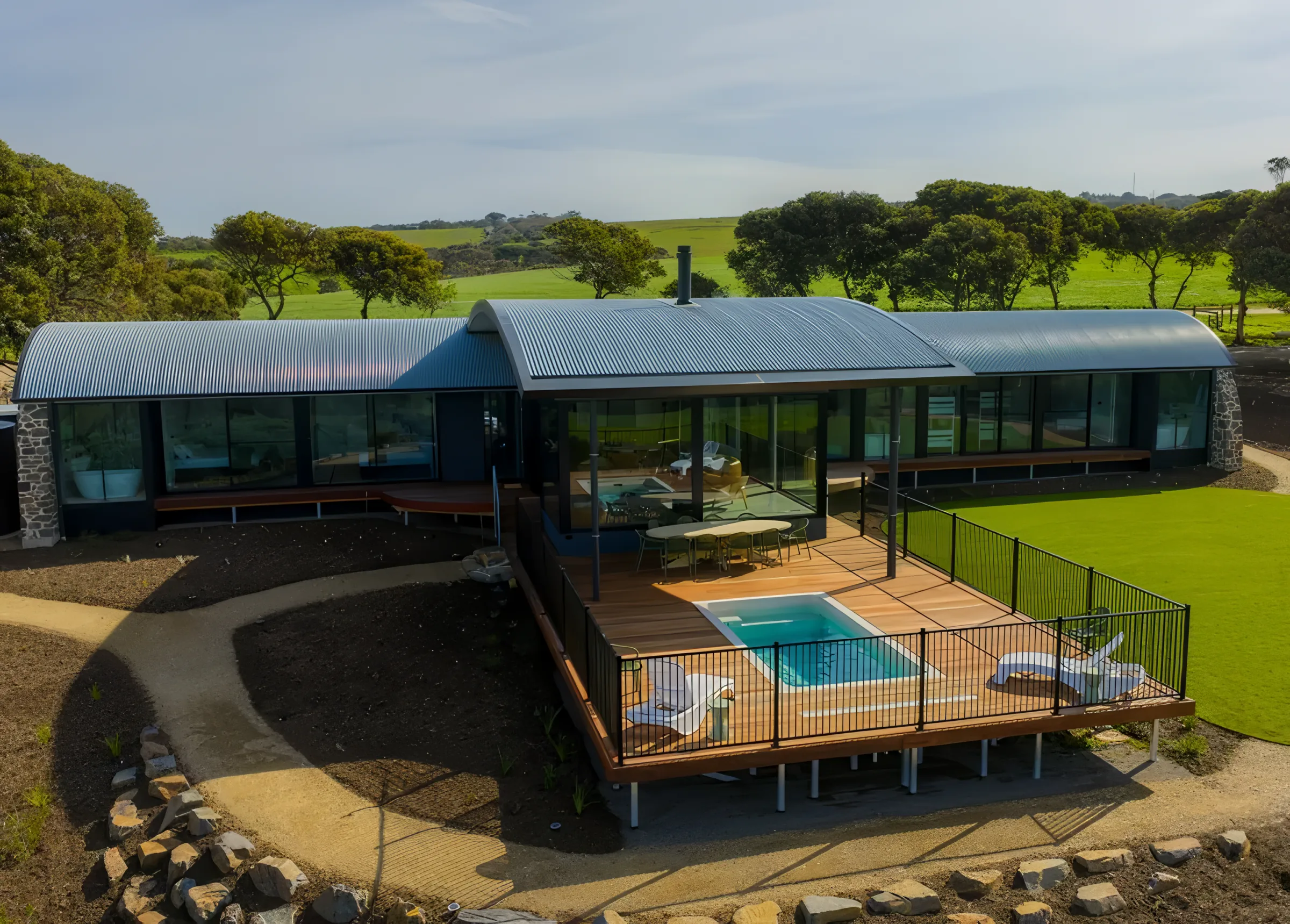 The Villa and pool from above, set in farmland above the bay