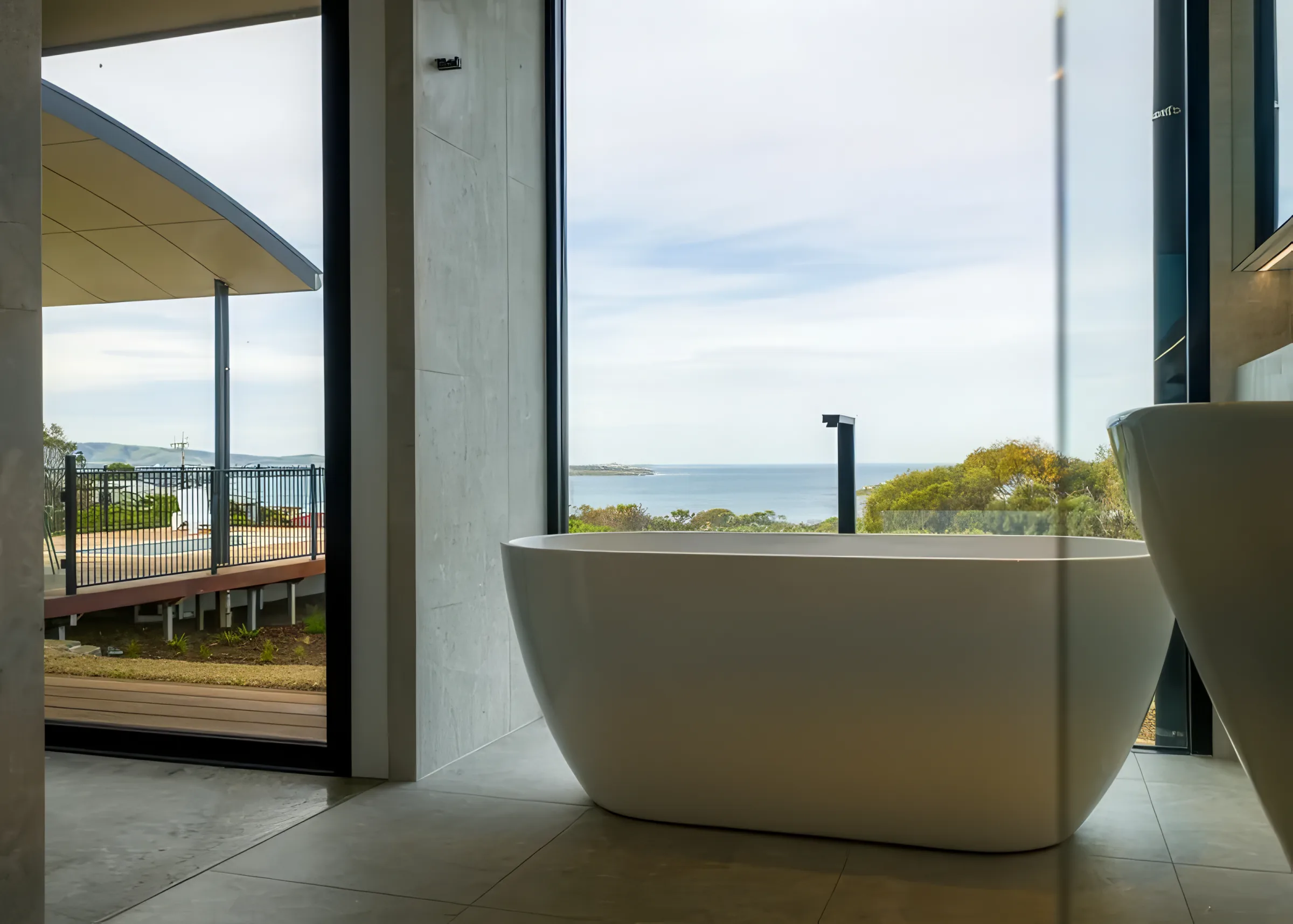 Freestanding bath looking out over the bay