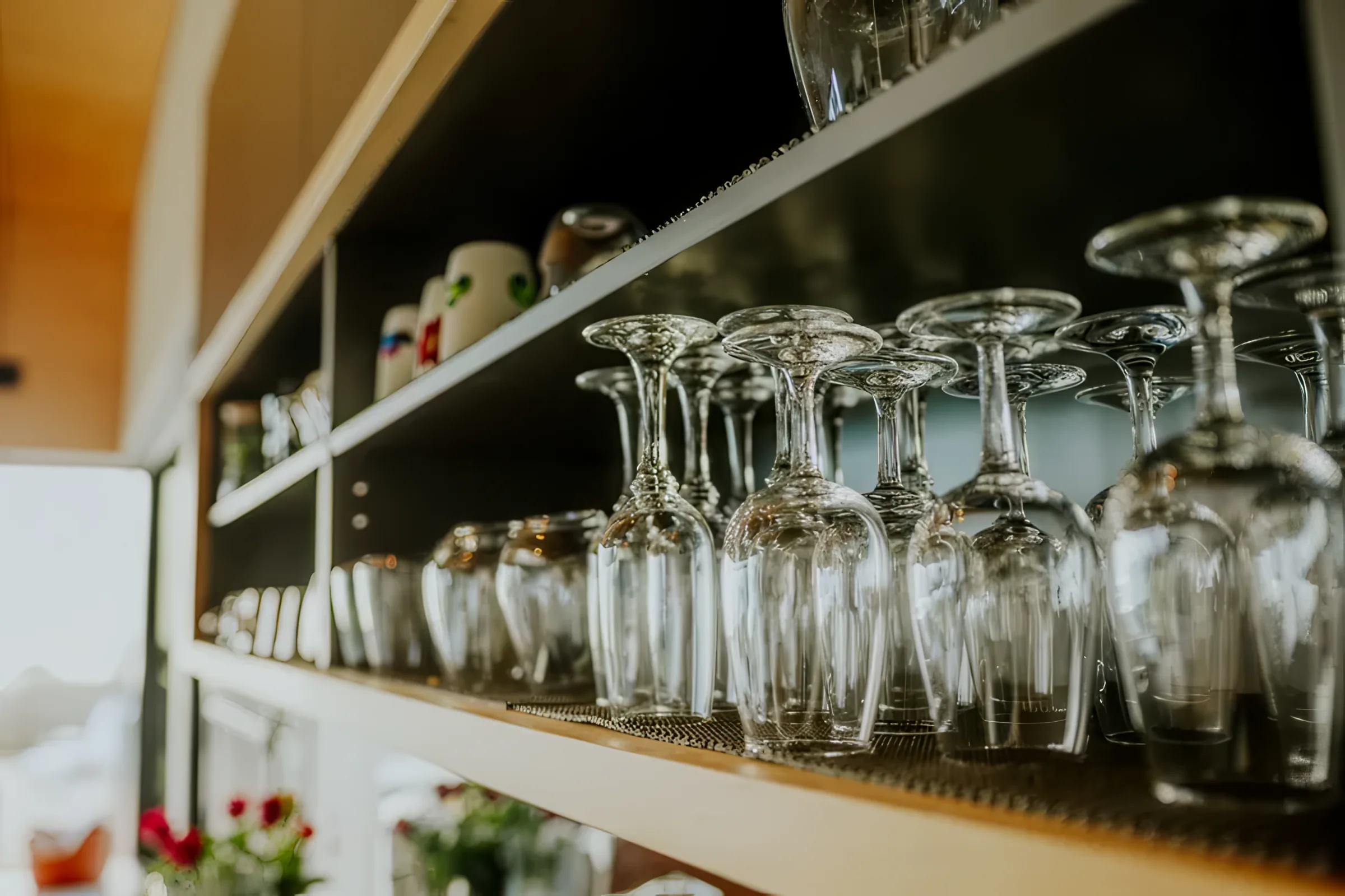 Glassware on open shelving in the kitchen