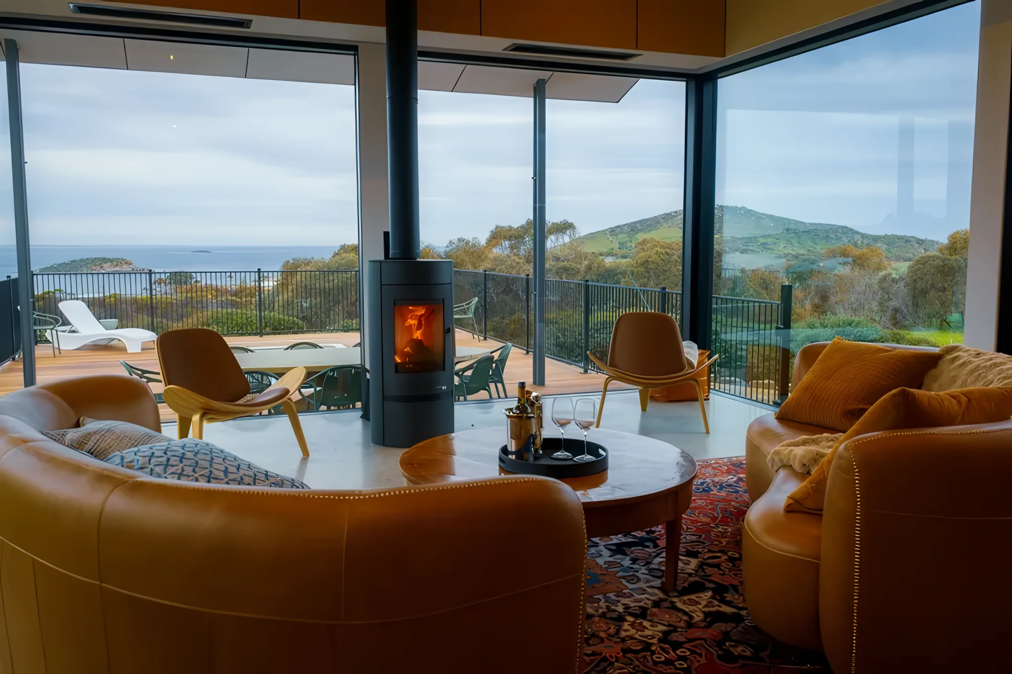 The great room at The Villa with fireplace and bay views