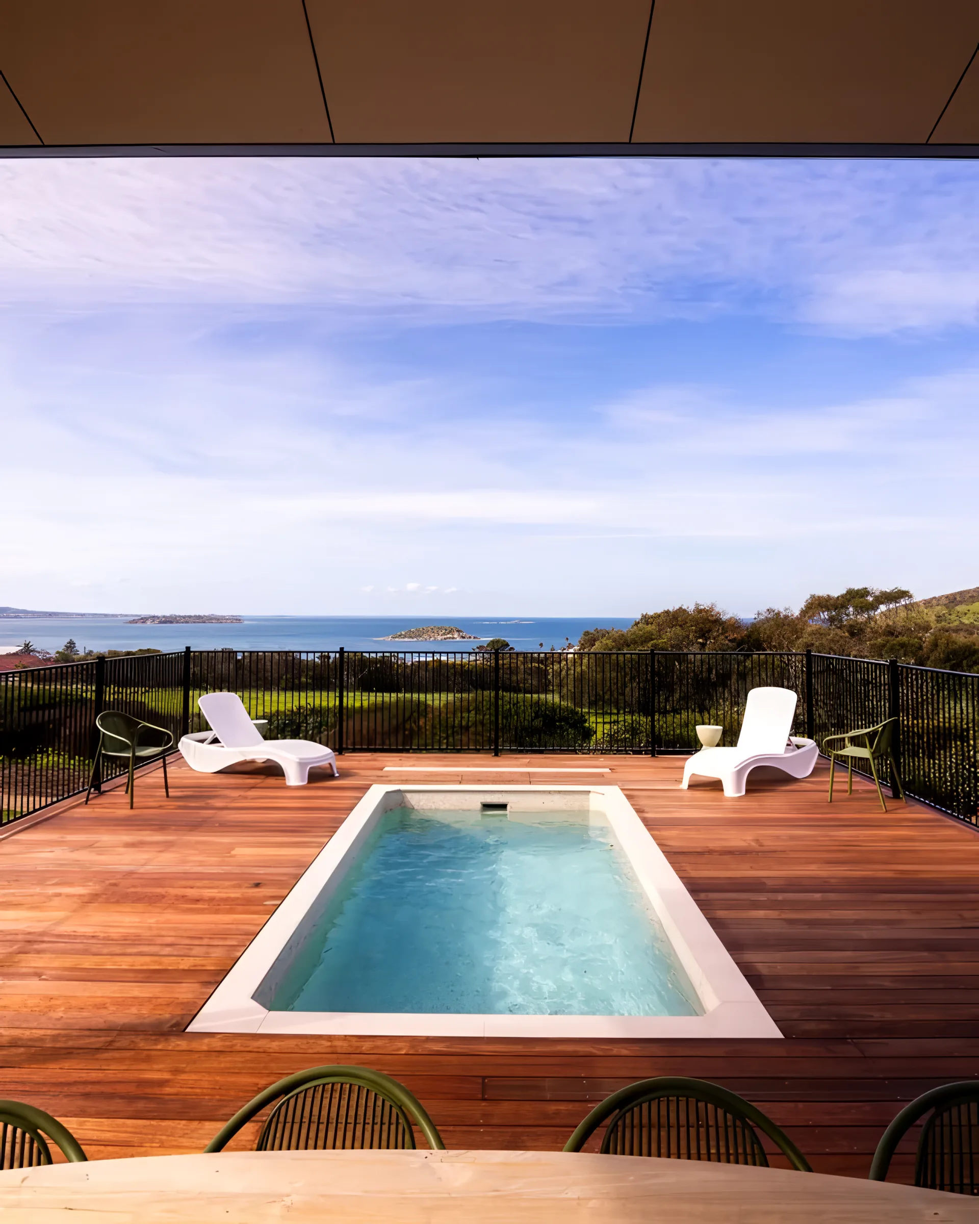 The pool at The Villa with the ocean beyond