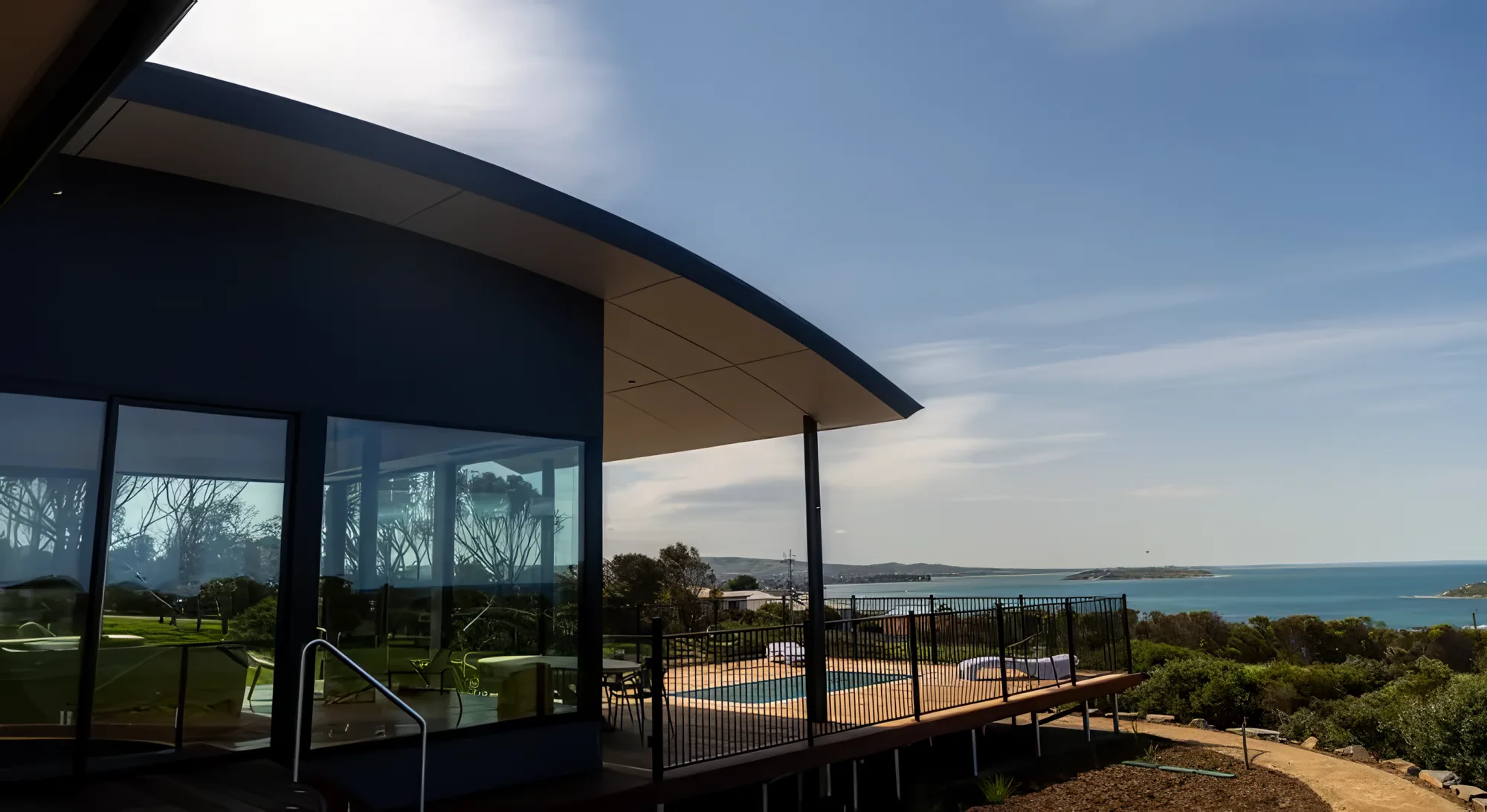 The Villa's signature curved roof against the bay